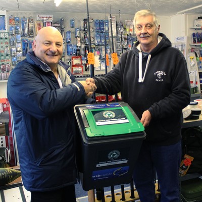 WSB general manager Mario (left) delivering one of the ANLRS bins to Camborne Tackle owner Graham