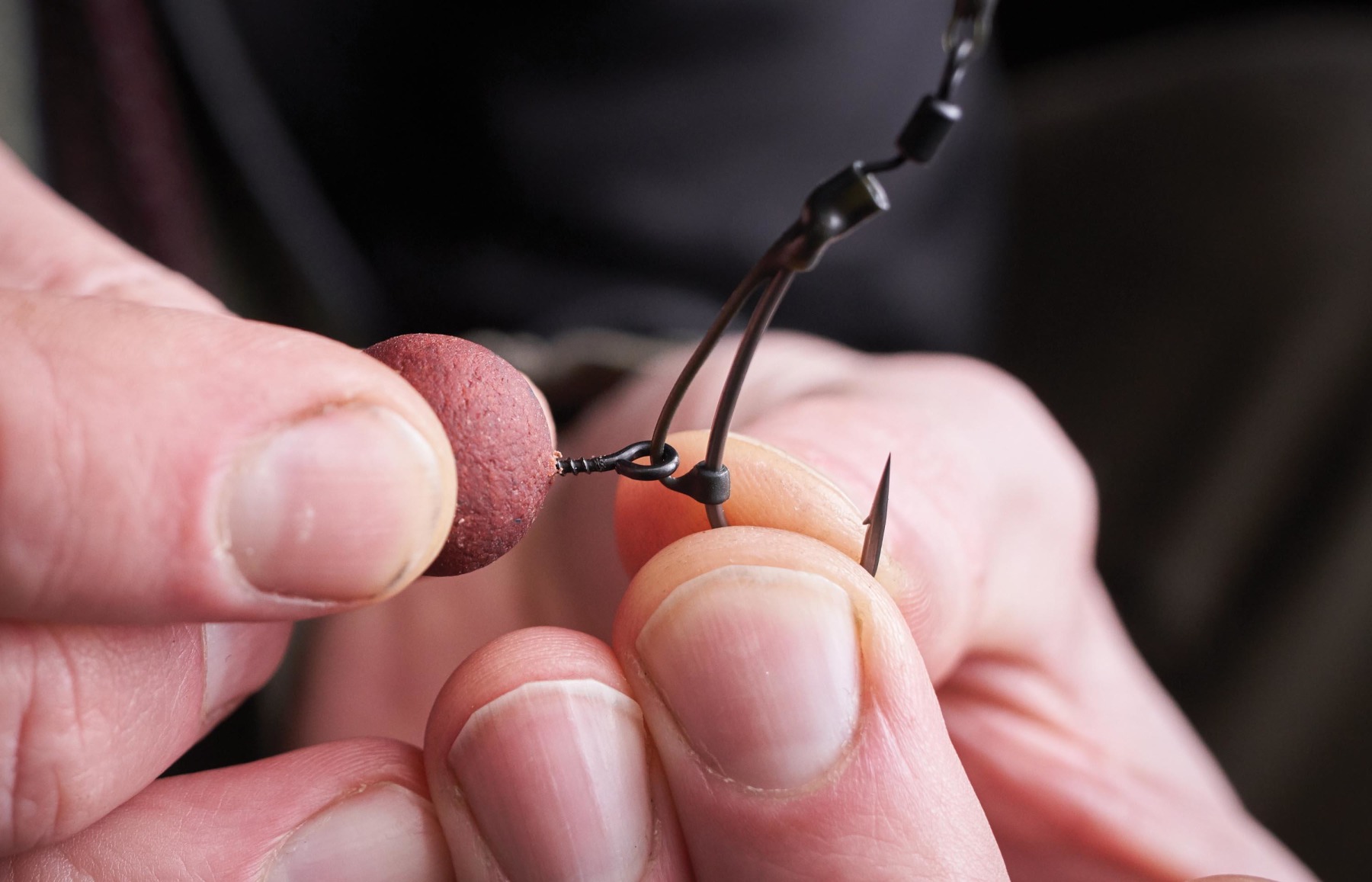 Carefully screwing a corkball pop-up onto the bore ring - this completely eradicates the need for tying the bait on with floss