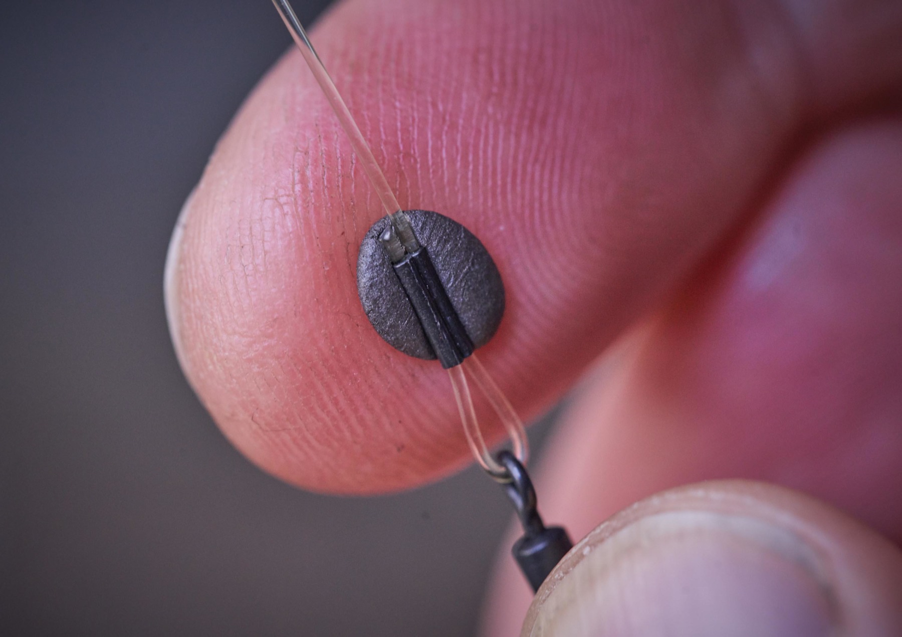 I simply add putty around the crimp at the hook end when using pop-ups