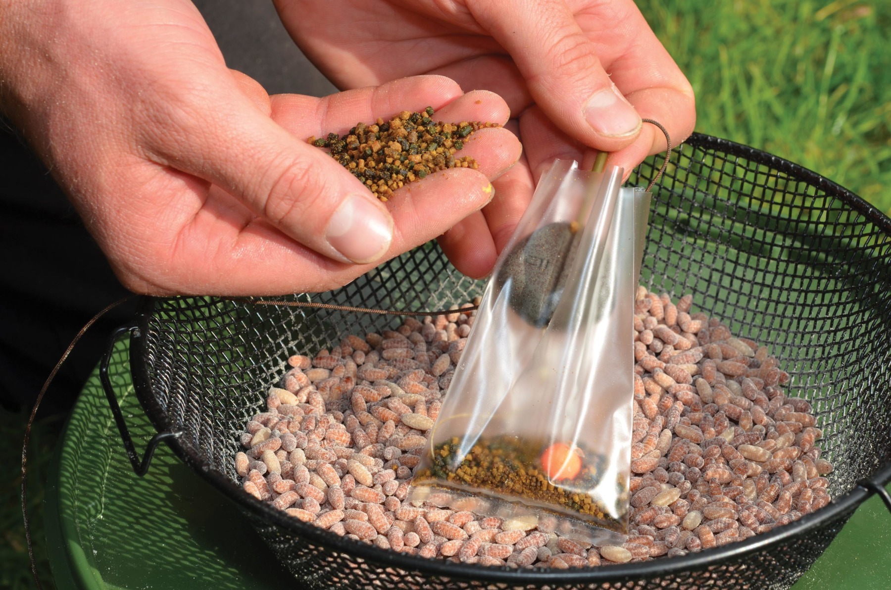 2. Follow this with a small handful of mini (2/3mm) pellets.