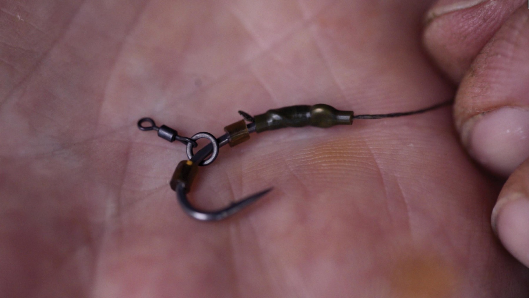 3. Unlike with a pop-up where you’d just use one, for this balanced set-up Tel traps the hookbait swivel between two Grip Stops