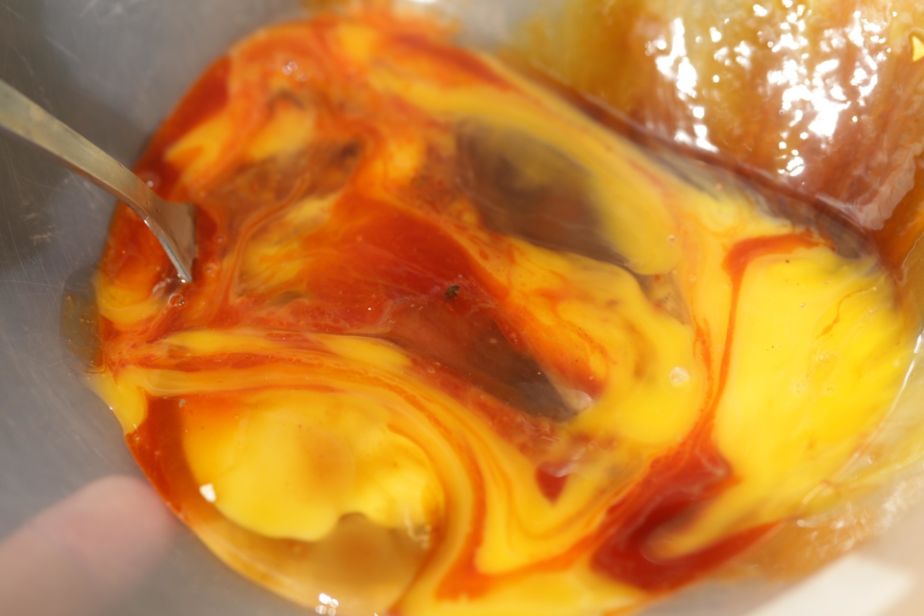 5. With the liquids all added, now whisk it all round into the eggs.