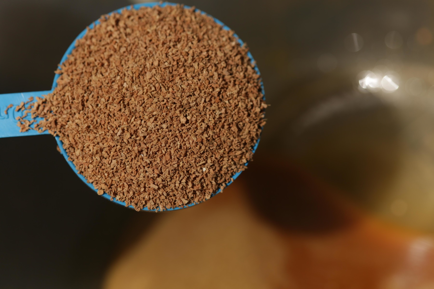 6. Next you need to add six scoops of cork-dust to the mixing bowl.