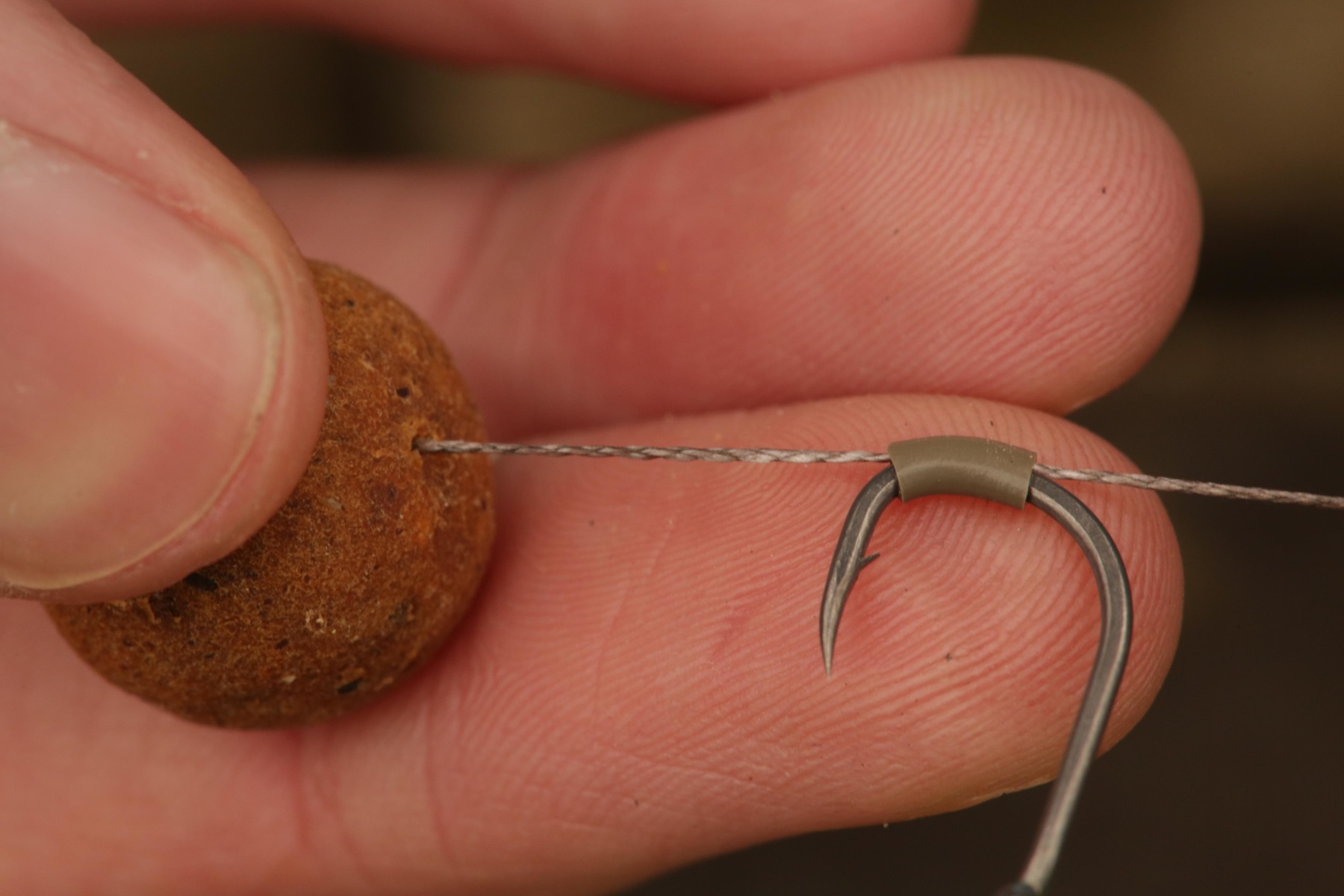 5. Thread on the hook through the silicone as shown. 