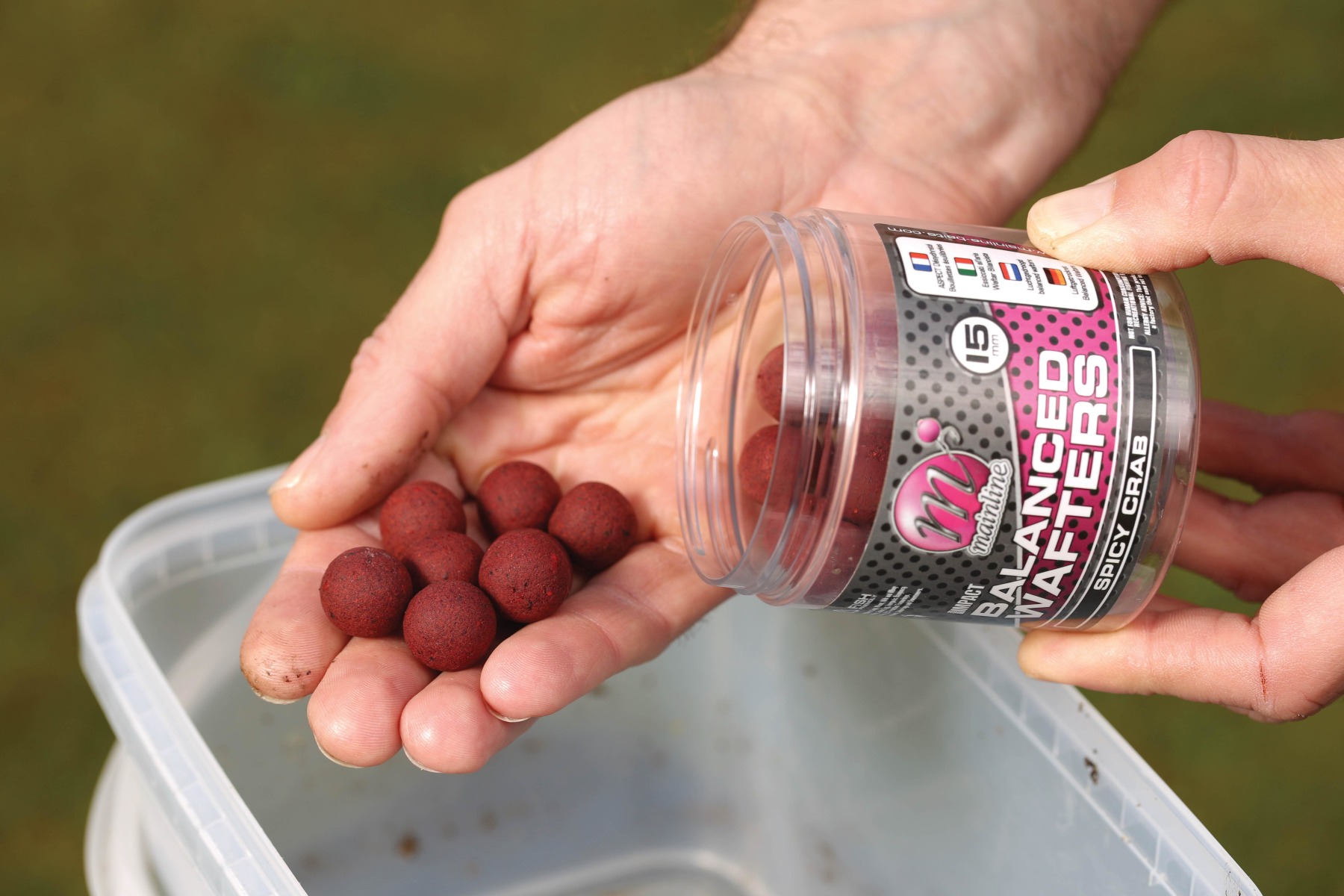 1. Start by adding your hookbaits like these Balanced Wafters to a large tub or bowl.